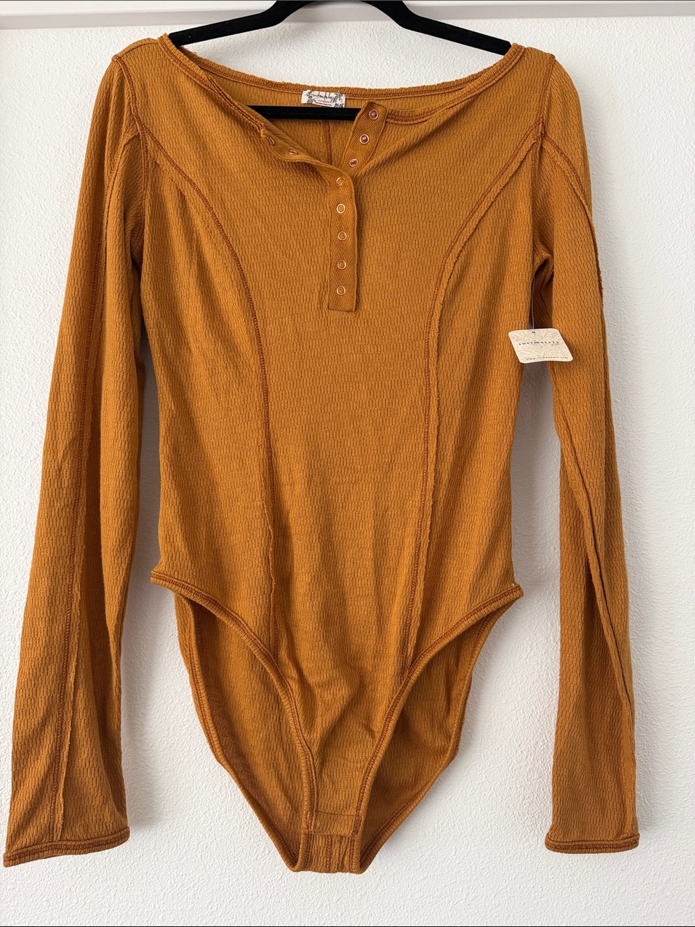 Free People Ribbed Long-Sleeve One-Piece Bodysuit in Mustard
